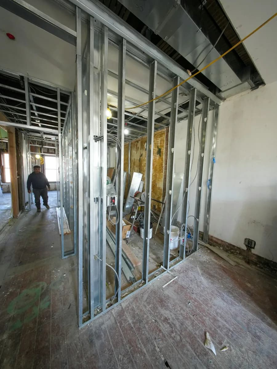Galvanised metal studs framing a partition wall